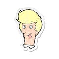 retro distressed sticker of a cartoon man with tongue hanging out Royalty Free Stock Photo