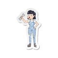 retro distressed sticker of a cartoon mechanic woman