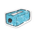 retro distressed sticker of a cartoon pencil sharpener Royalty Free Stock Photo