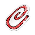 retro distressed sticker of a cartoon red paperclip Royalty Free Stock Photo