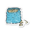 retro distressed sticker of a cartoon sack of potatoes