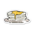 retro distressed sticker of a cartoon stack of pancakes