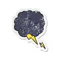 retro distressed sticker of a cartoon thundercloud symbol Royalty Free Stock Photo