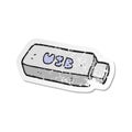 retro distressed sticker of a cartoon USB stick Royalty Free Stock Photo