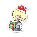 retro distressed sticker of a cartoon woman opening presents