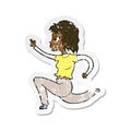 retro distressed sticker of a cartoon woman running and pointing Royalty Free Stock Photo