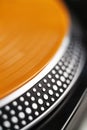 Vinyl record disc with music on turntables platter in close up. Vintage disc jockey analog audio Royalty Free Stock Photo