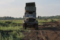 Retro dump truck on a quarry with a raised body