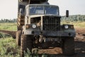 Retro dump truck on a quarry with a raised body