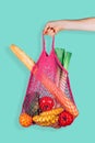 Retro and ecological string shopping bag in woman hand