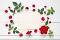 Retro empty photo frame for the inside and red rose flowers on white background. Royalty Free Stock Photo