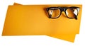 Retro eyeglasses with black frame on orange creative support