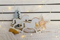 retro figure of a rocking horse on the background of Christmas lights Royalty Free Stock Photo