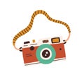 Retro film photo camera with strap isolated on white background. Old analog photocamera. Hand-drawn colored flat vector Royalty Free Stock Photo