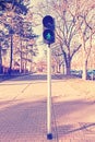 Retro filtered photo of traffic lights, green color