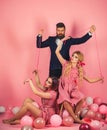 Retro girls and master in party balloons. Creative idea. Love triangle. Crazy girls and man on pink. Halloween. vintage