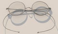 Round vintage glasses with thin metal frames and clear lenses