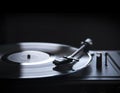 Retro gramophone vinyl player over black background with copyspace. Royalty Free Stock Photo