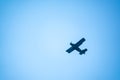 Retro green biplane plane in the blue sky Royalty Free Stock Photo