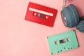 Retro green and red audio cassette tape and headphones Royalty Free Stock Photo
