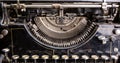 Retro grunge black typewriter closeup