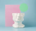 Retro head sculpture against the pastel background and circular illustration element.