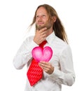 Retro hippie man holding love heart thinking