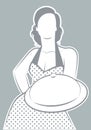 Retro housewife cook wearing polka dot dress showing a plate or tray
