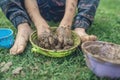 Toddler child enjoying nature playing with mud Royalty Free Stock Photo