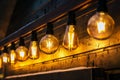 Retro incandescent lamps on the facade of the house decorated