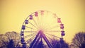 Retro instagram toned silhouette of ferris wheel. Royalty Free Stock Photo
