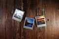 Retro instant camera photos of Minnesota, including Split Rock lighthouse and the Minneapolis skyline, on rustic hardwood