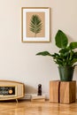 Retro space interior at home with gold mock up frame and vintage radio and potted plants. Royalty Free Stock Photo