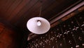 Retro Lamp and White Round Luminaire Hanging from the Ceiling Royalty Free Stock Photo