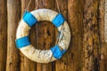 Retro lifebuoy in Greek national colors blue and white hanging o Royalty Free Stock Photo