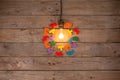 Retro light bulb and group of jigsaws on wooden background - idea, innovation, teamwork and leadership concept. Space for text Royalty Free Stock Photo