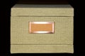 Retro Light khaki file-storage box covered with tweed fabric with blank label in copper frame Royalty Free Stock Photo