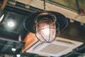 Retro lighting decor in coffee shop.Hang ceiling lamp for interior design and decoration. Royalty Free Stock Photo