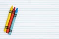 Retro lined paper with a three crayons Royalty Free Stock Photo