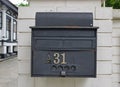 Retro looking rustic outdoor wall attached letter box Royalty Free Stock Photo