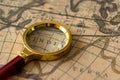 Retro magnifier with old map Royalty Free Stock Photo