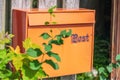 Retro mail box on a wooden fence Royalty Free Stock Photo