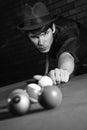 Retro male shooting pool. Royalty Free Stock Photo