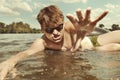 Retro man in summer lake have fun with inner tube Royalty Free Stock Photo