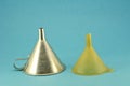 Retro metal and plastic funnel tool on blue background Royalty Free Stock Photo
