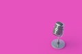 Retro metallic microphone on pink background. Radio broadcast. Online streaming. Declaration of information Royalty Free Stock Photo