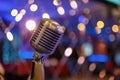 Retro microphone on the background of blurred lights Royalty Free Stock Photo