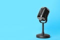 Retro microphone on light blue background. Interview Royalty Free Stock Photo