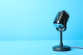 Retro microphone on blue background, space for text. Interview Royalty Free Stock Photo