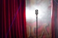 Retro microphone and red curtain Royalty Free Stock Photo